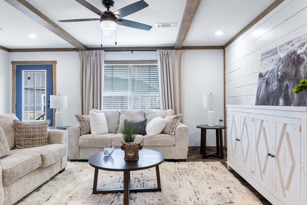 The SAWYER ELITE Living Room. This Manufactured Mobile Home features 3 bedrooms and 2 baths.