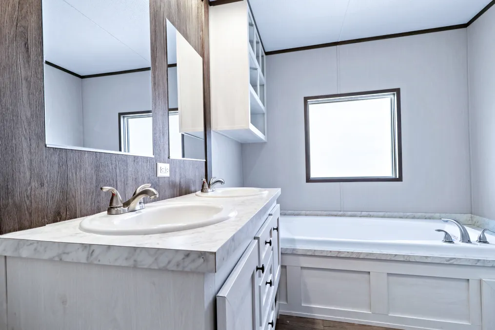 The ANNIVERSARY 16763S Primary Bathroom. This Manufactured Mobile Home features 3 bedrooms and 2 baths.