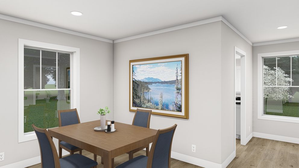 The LET IT BE Dining Room. This Manufactured Mobile Home features 3 bedrooms and 2 baths.