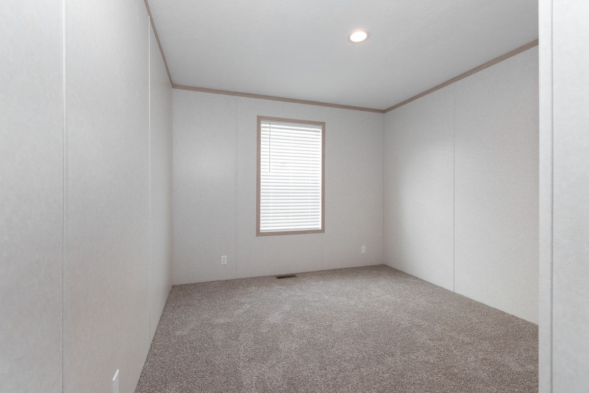 The 5628-5202 ADRENALINE Guest Bedroom. This Manufactured Mobile Home features 3 bedrooms and 2 baths.