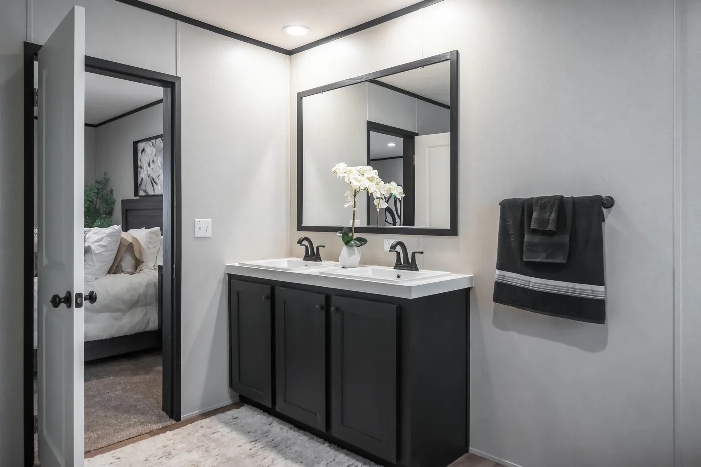 The ABSOLUTE VALUE Primary Bathroom. This Manufactured Mobile Home features 4 bedrooms and 2 baths.