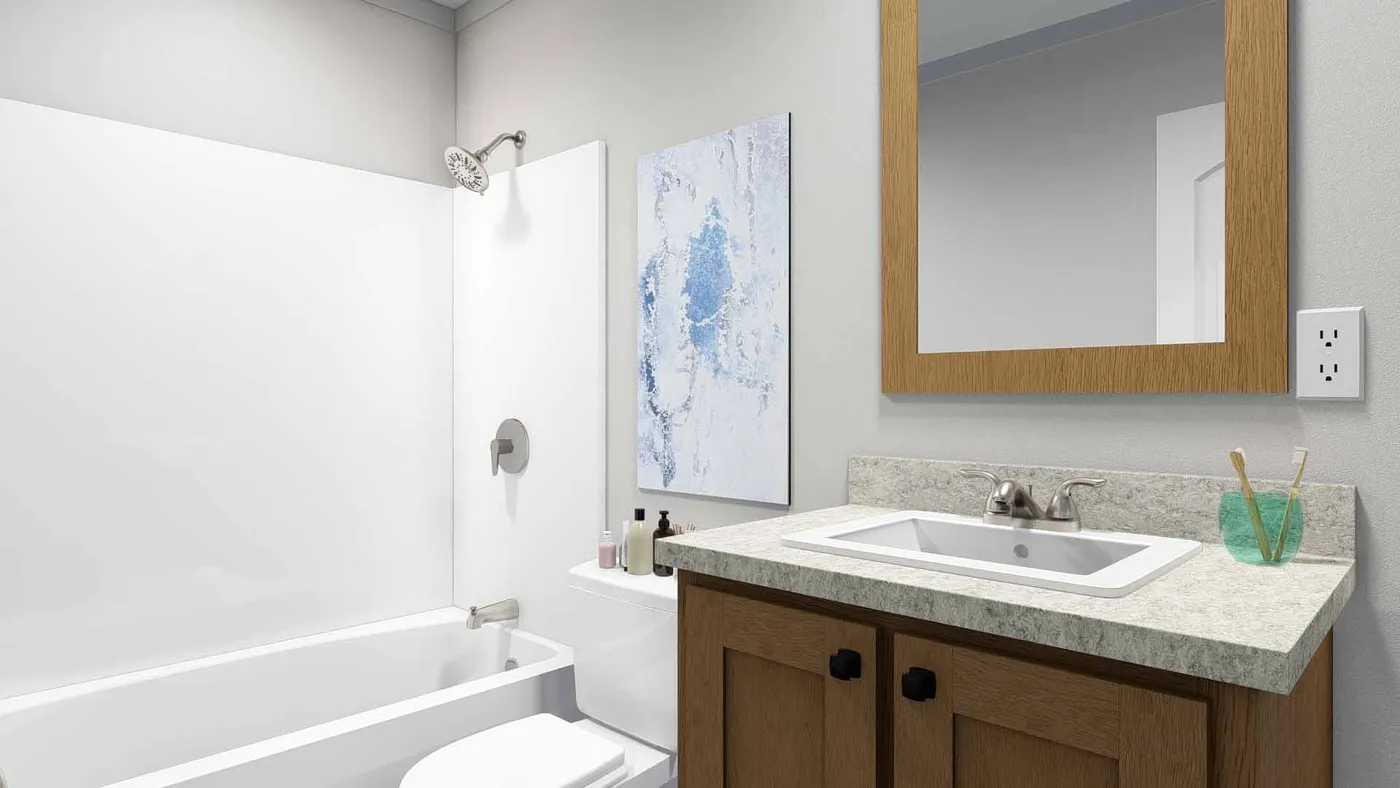 The SWEET DREAMS Guest Bathroom. This Manufactured Mobile Home features 3 bedrooms and 2 baths.