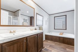 The THE SUNDOWNER Primary Bathroom. This Manufactured Mobile Home features 3 bedrooms and 2 baths.