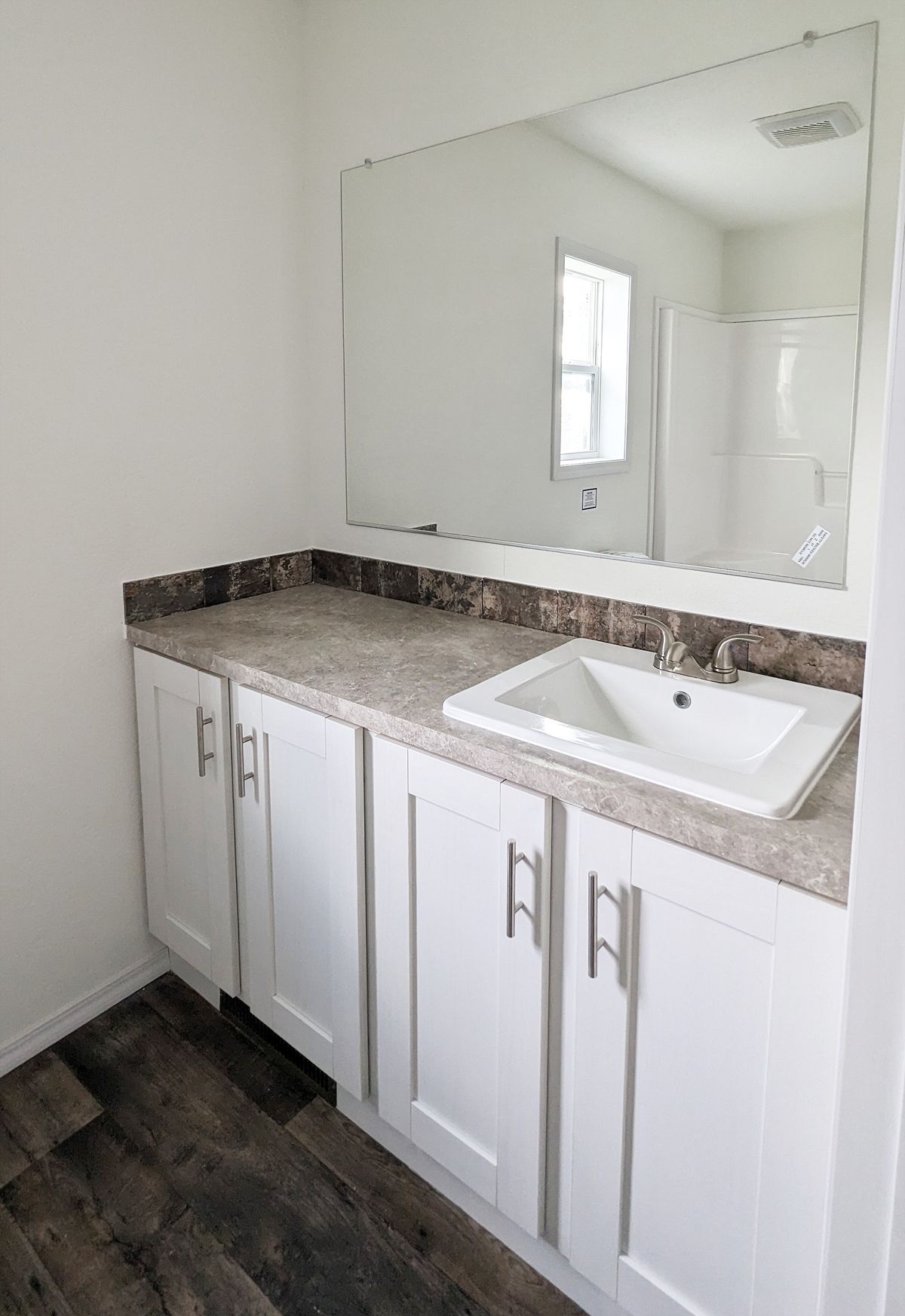 The LIFESTYLE 216-1 Primary Bathroom. This Manufactured Mobile Home features 3 bedrooms and 2 baths.