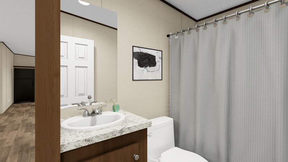 The TRIUMPH Guest Bathroom. This Manufactured Mobile Home features 5 bedrooms and 3 baths.