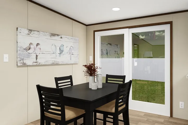 The SATISFACTION Dining Area. This Manufactured Mobile Home features 3 bedrooms and 2 baths.