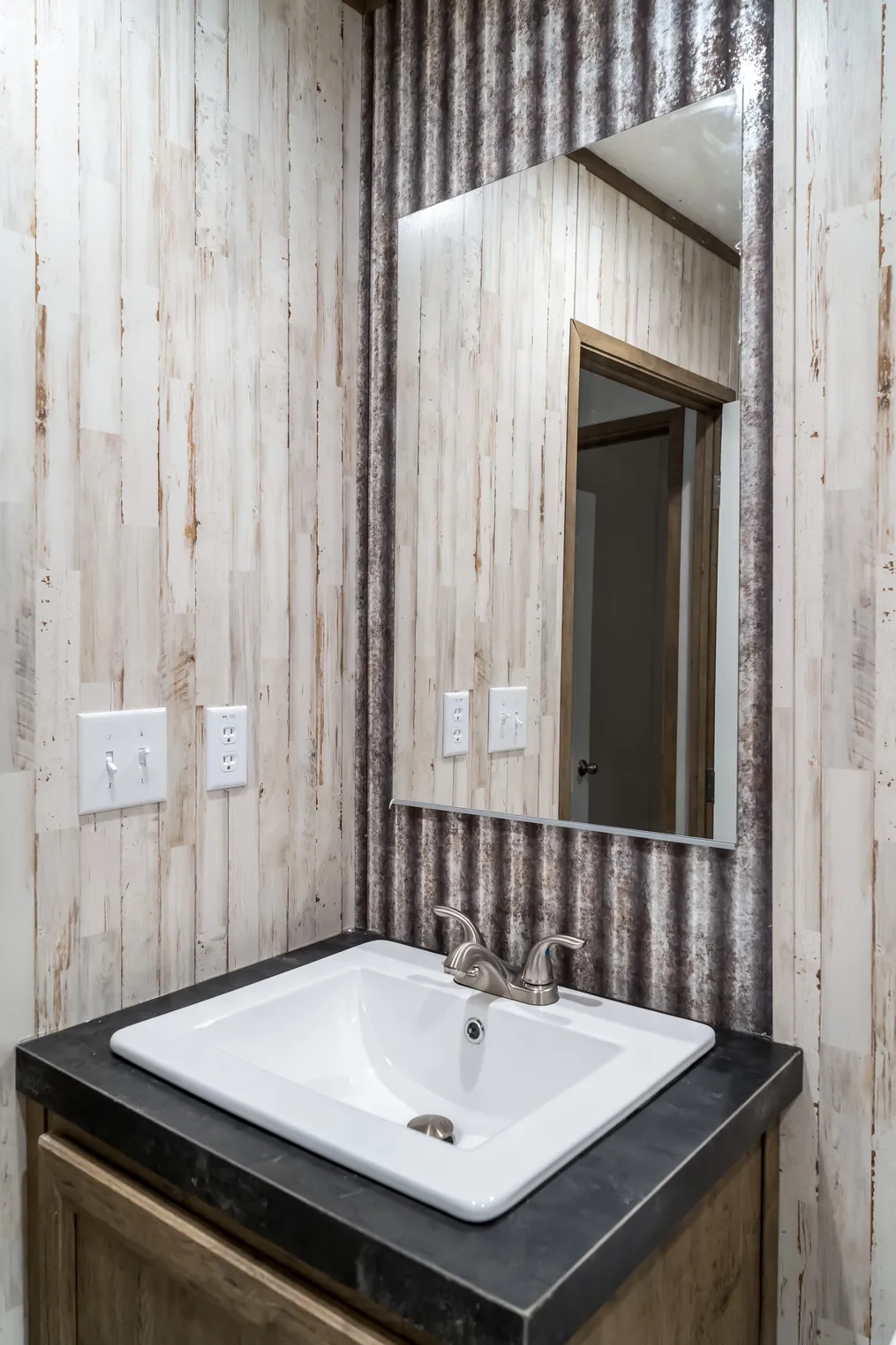 The ANNIVERSARY SPLASH Guest Bathroom. This Manufactured Mobile Home features 3 bedrooms and 2 baths.