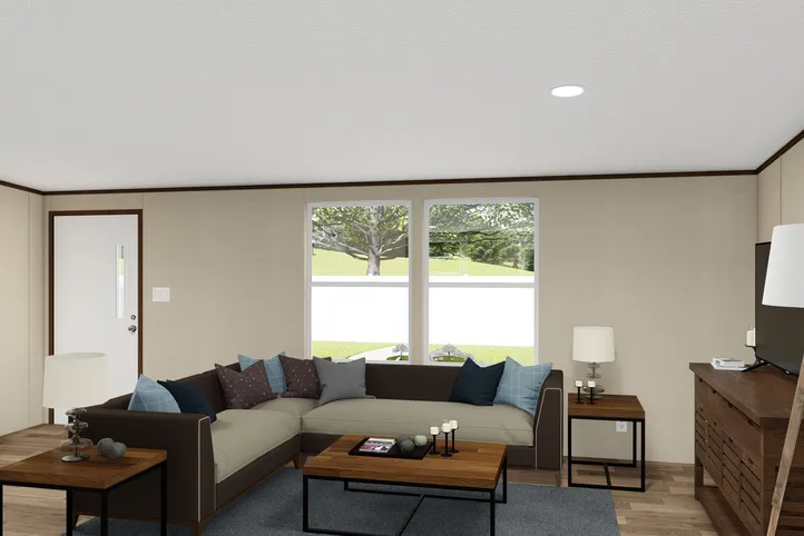 The SATISFACTION Living Room. This Manufactured Mobile Home features 3 bedrooms and 2 baths.