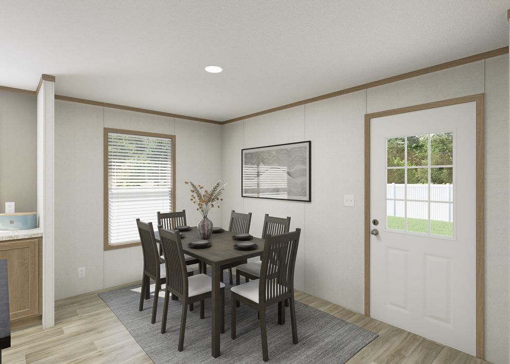 The THE RESERVE 52 Dining Area. This Manufactured Mobile Home features 3 bedrooms and 2 baths.