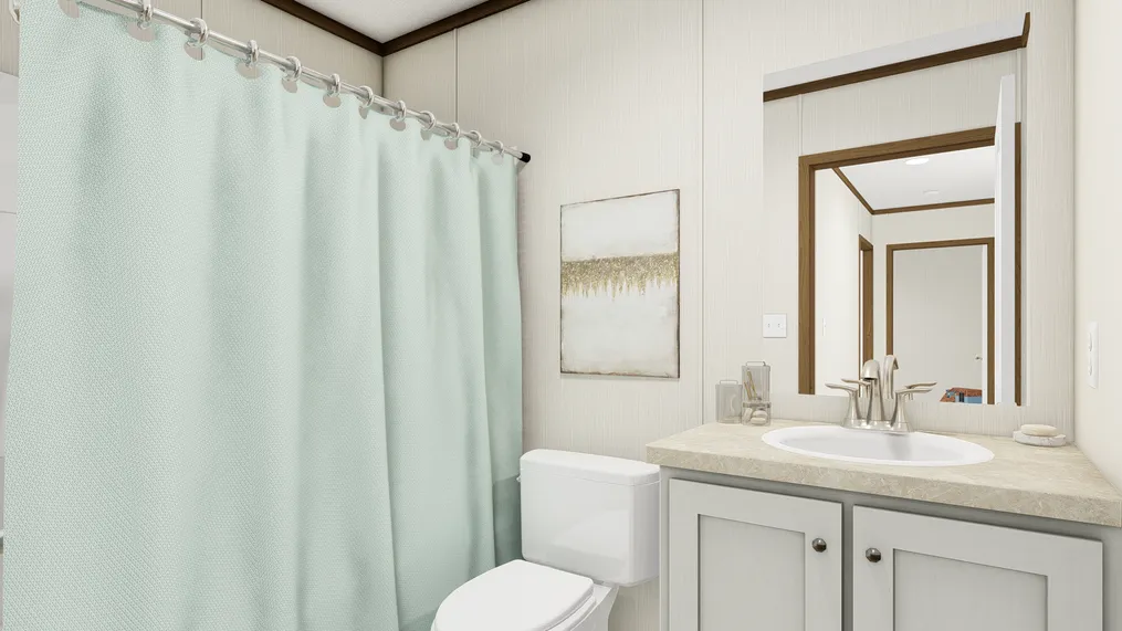 The DYNAMIC Guest Bathroom. This Manufactured Mobile Home features 3 bedrooms and 2 baths.