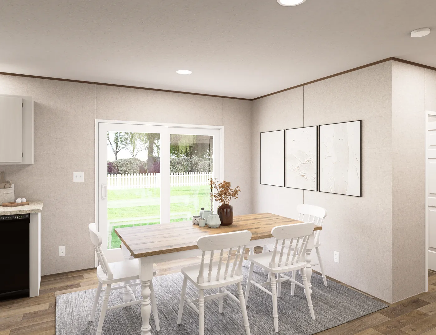 The SPRUCE Dining Area. This Manufactured Mobile Home features 3 bedrooms and 2 baths.