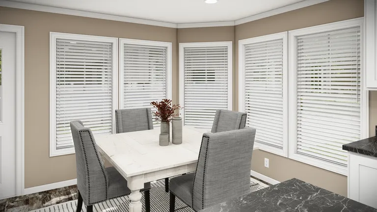 The THE MAVERICK Dining Area. This Manufactured Mobile Home features 3 bedrooms and 2 baths.
