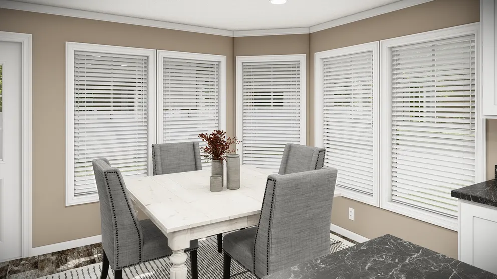 The THE MAVERICK Dining Area. This Manufactured Mobile Home features 3 bedrooms and 2 baths.
