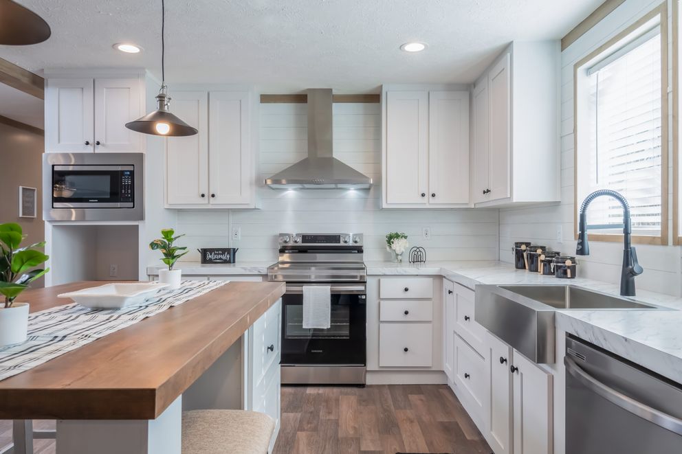 The FARMHOUSE BREEZE 72 Kitchen. This Manufactured Mobile Home features 4 bedrooms and 2 baths.