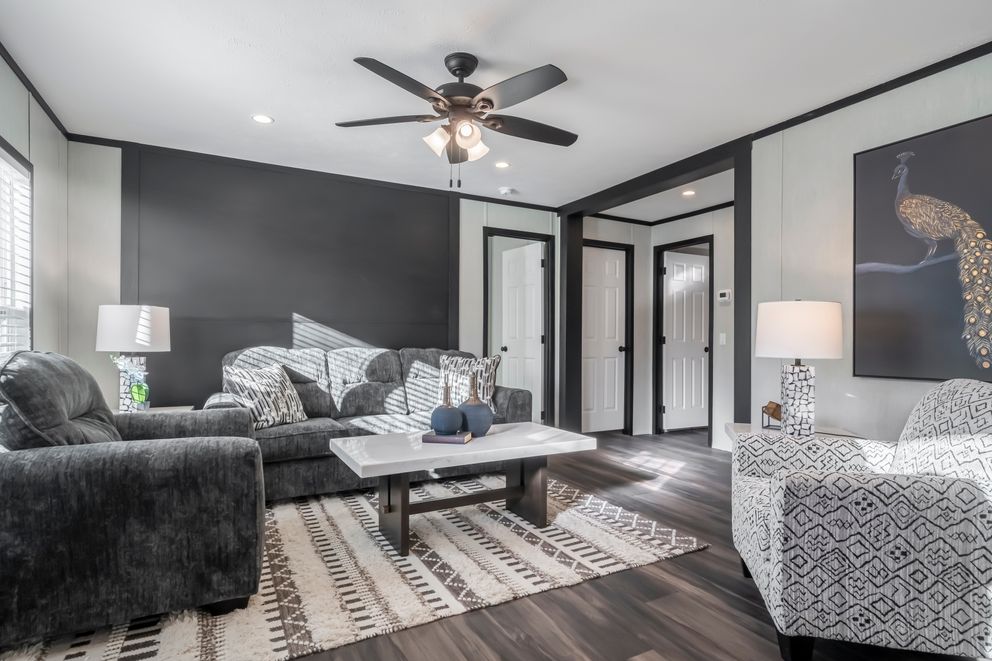 The LIL SOUTHERN CHARM Living Room. This Manufactured Mobile Home features 3 bedrooms and 2 baths.