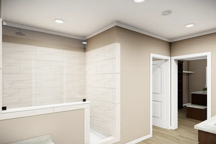 The THE BRYANT Primary Bedroom. This Manufactured Mobile Home features 4 bedrooms and 2 baths.