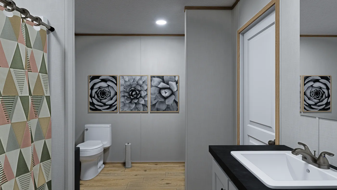 The ECLIPSE Primary Bathroom. This Manufactured Mobile Home features 4 bedrooms and 2 baths.