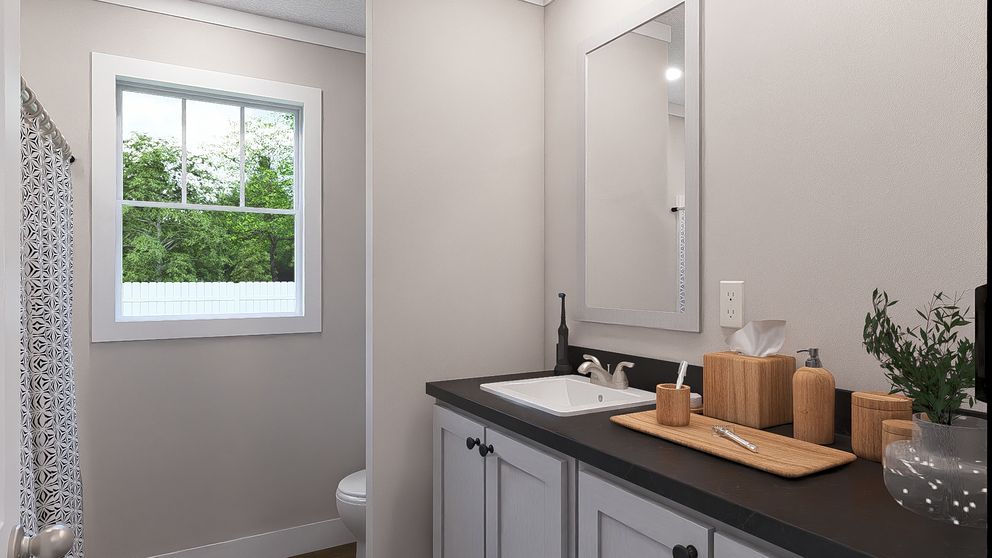 The BROWN EYED GIRL Guest Bathroom. This Manufactured Mobile Home features 4 bedrooms and 2 baths.