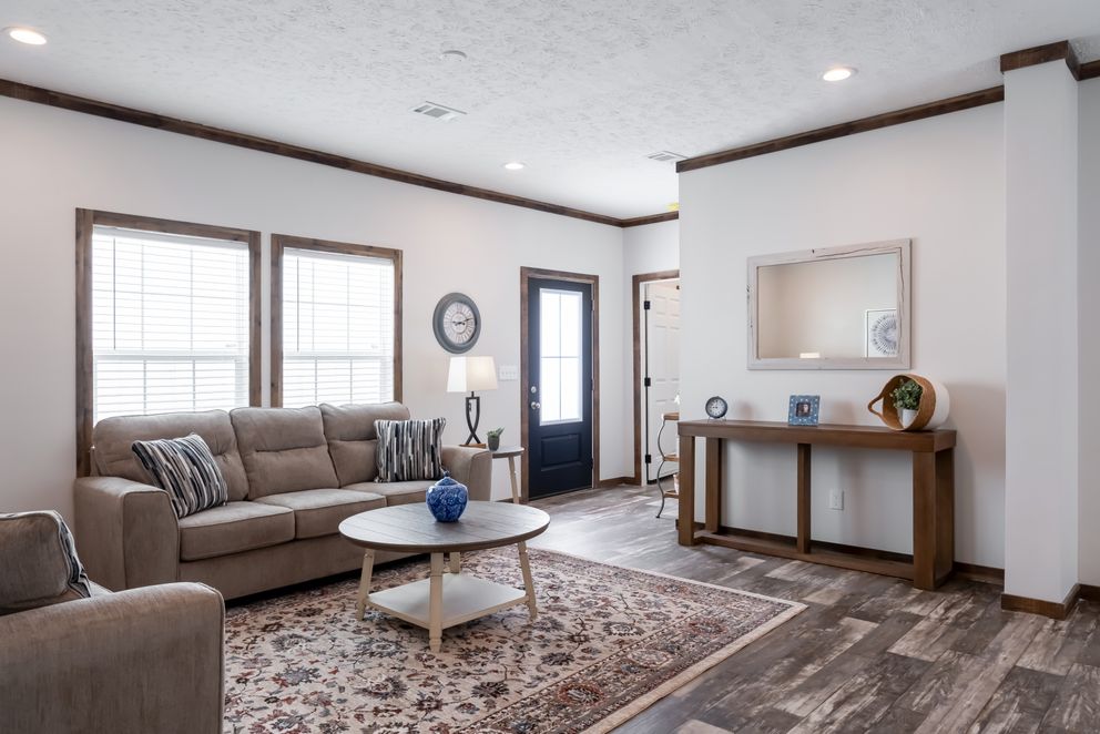 The 3237 THE TYBEE HUD Living Room. This Manufactured Mobile Home features 4 bedrooms and 3 baths.