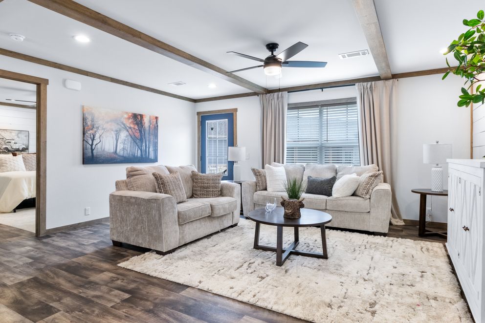 The SAWYER ELITE Living Room. This Manufactured Mobile Home features 3 bedrooms and 2 baths.