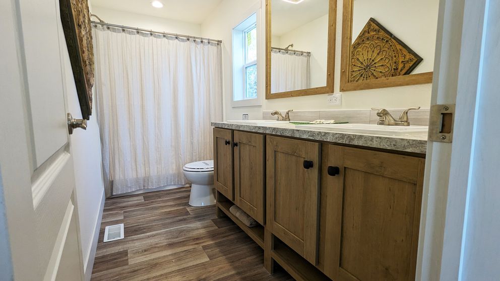 The JOHNNY B GOODE Primary Bathroom. This Manufactured Mobile Home features 3 bedrooms and 2 baths.