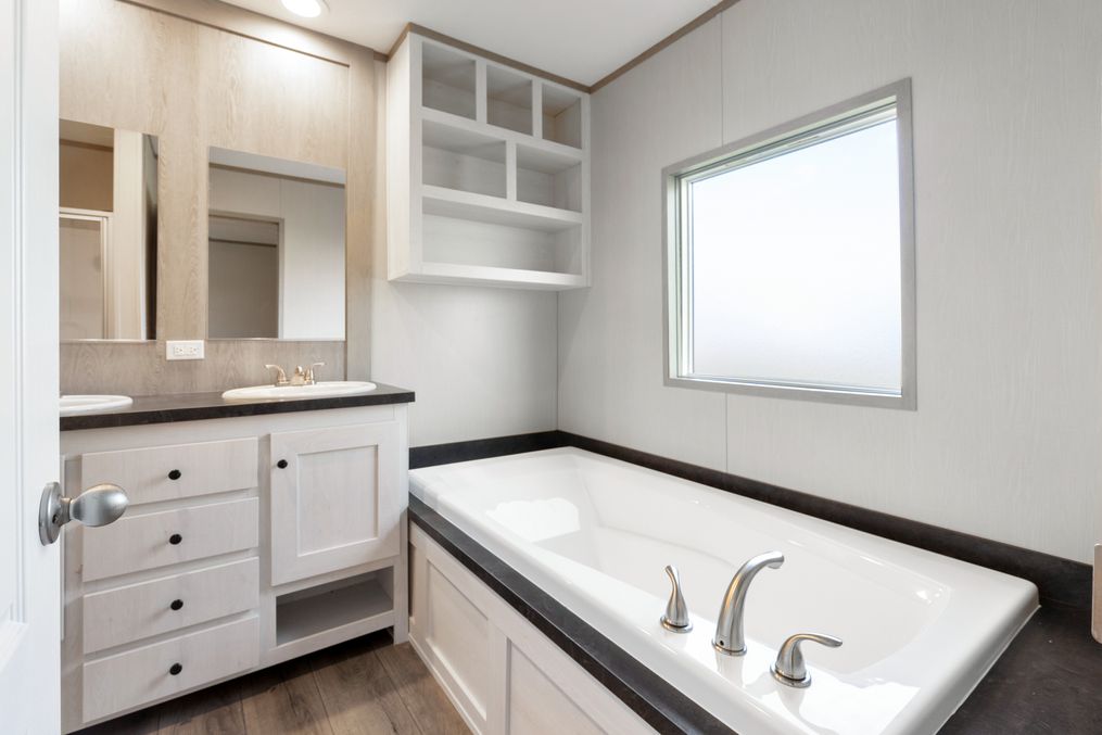 The ANNIVERSARY 16682A Primary Bathroom. This Manufactured Mobile Home features 2 bedrooms and 2 baths.