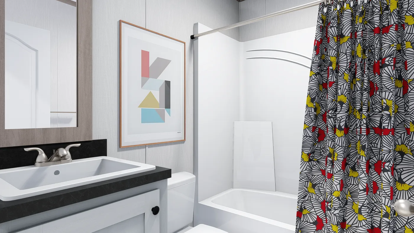 The 5624-E744 THE PULSE Guest Bathroom. This Manufactured Mobile Home features 3 bedrooms and 2 baths.