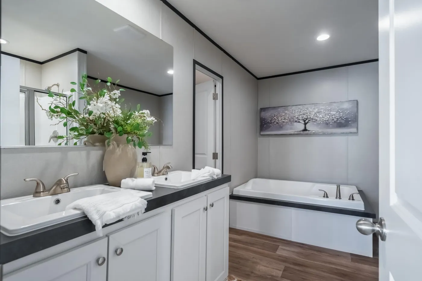 The ELEMENT Primary Bathroom. This Manufactured Mobile Home features 3 bedrooms and 2 baths.