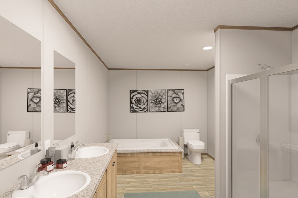 The THE EAGLE 52 Primary Bathroom. This Manufactured Mobile Home features 3 bedrooms and 2 baths.