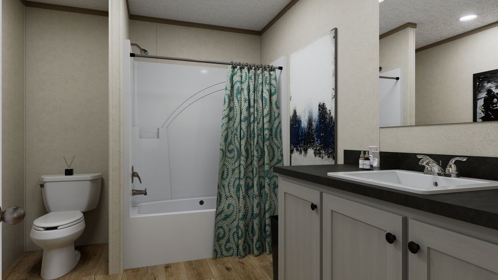 The 4824-CC54 OAKSTEAD 48 Primary Bedroom. This Manufactured Mobile Home features 3 bedrooms and 2 baths.