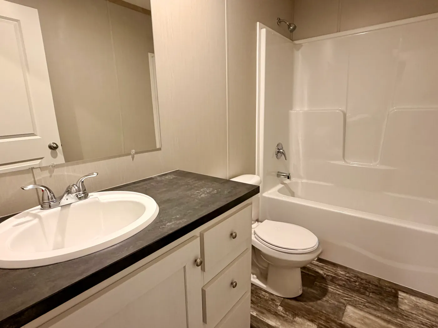 The FRANKLIN Guest Bathroom. This Manufactured Mobile Home features 3 bedrooms and 2 baths.