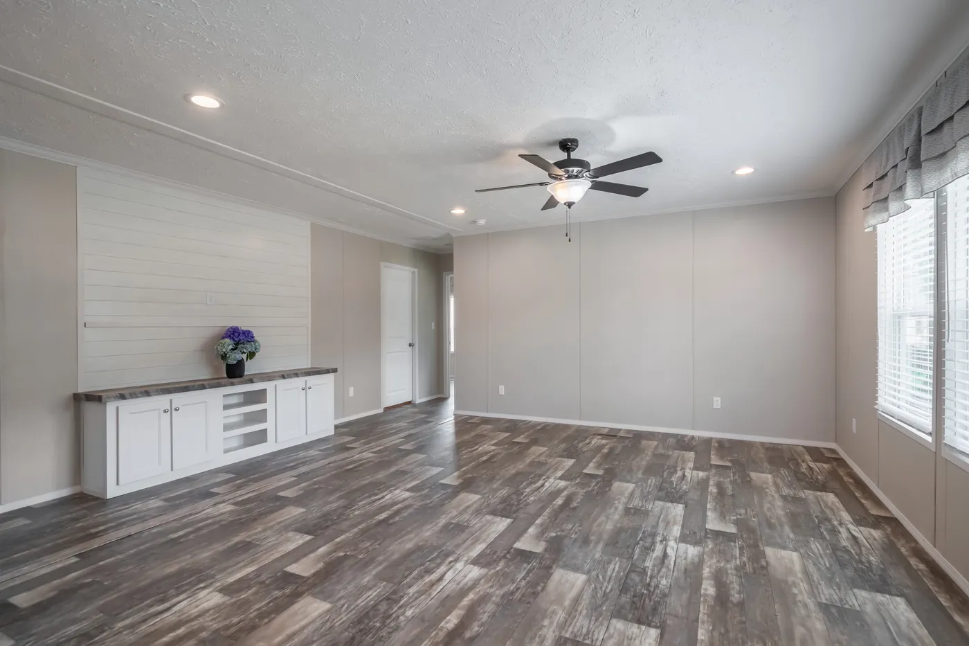 The NORTHSHORE Living Room. This Manufactured Mobile Home features 3 bedrooms and 2 baths.