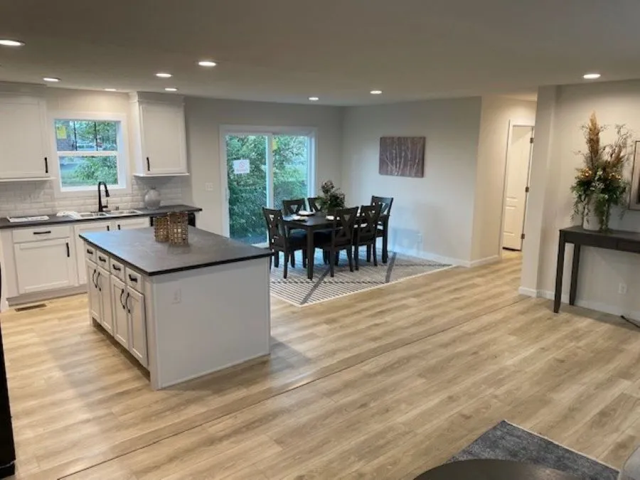 The MICHIGAN AVE/6028-MS026-1 SECT Dining Area. This Manufactured Mobile Home features 3 bedrooms and 2 baths.