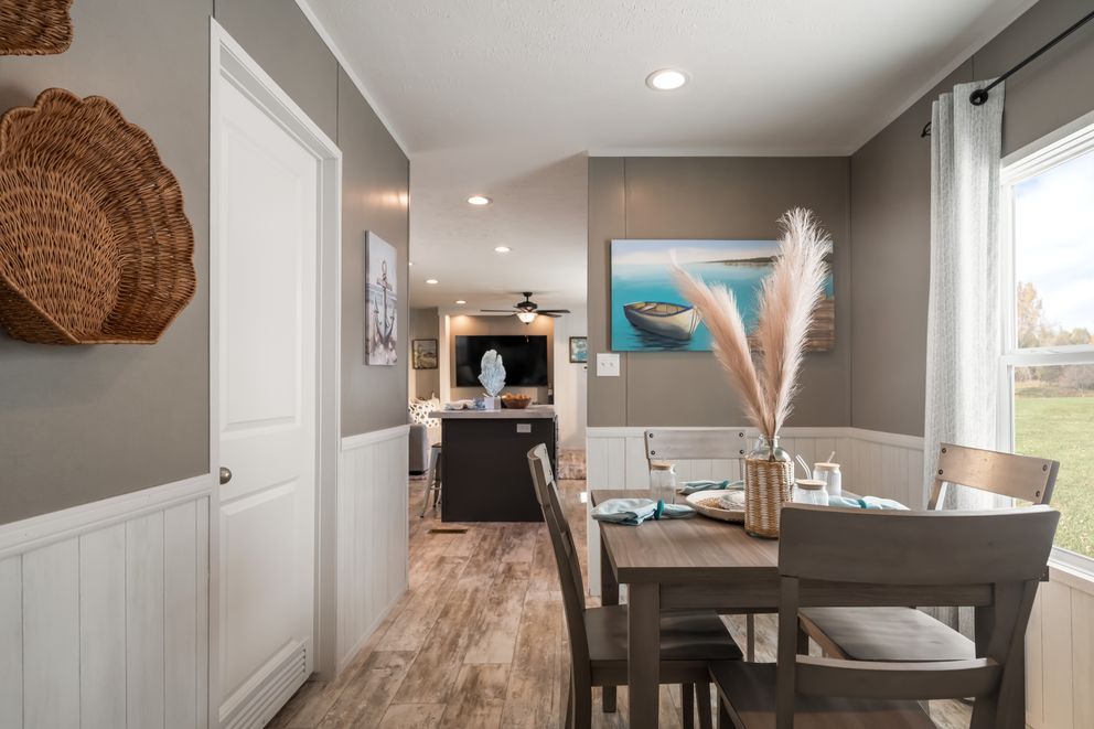 The THE DRIFTWOOD Dining Room. This Manufactured Mobile Home features 3 bedrooms and 2 baths.