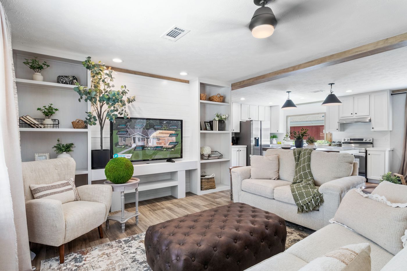 The THE REAL DEAL Living Room. This Manufactured Mobile Home features 3 bedrooms and 2 baths.