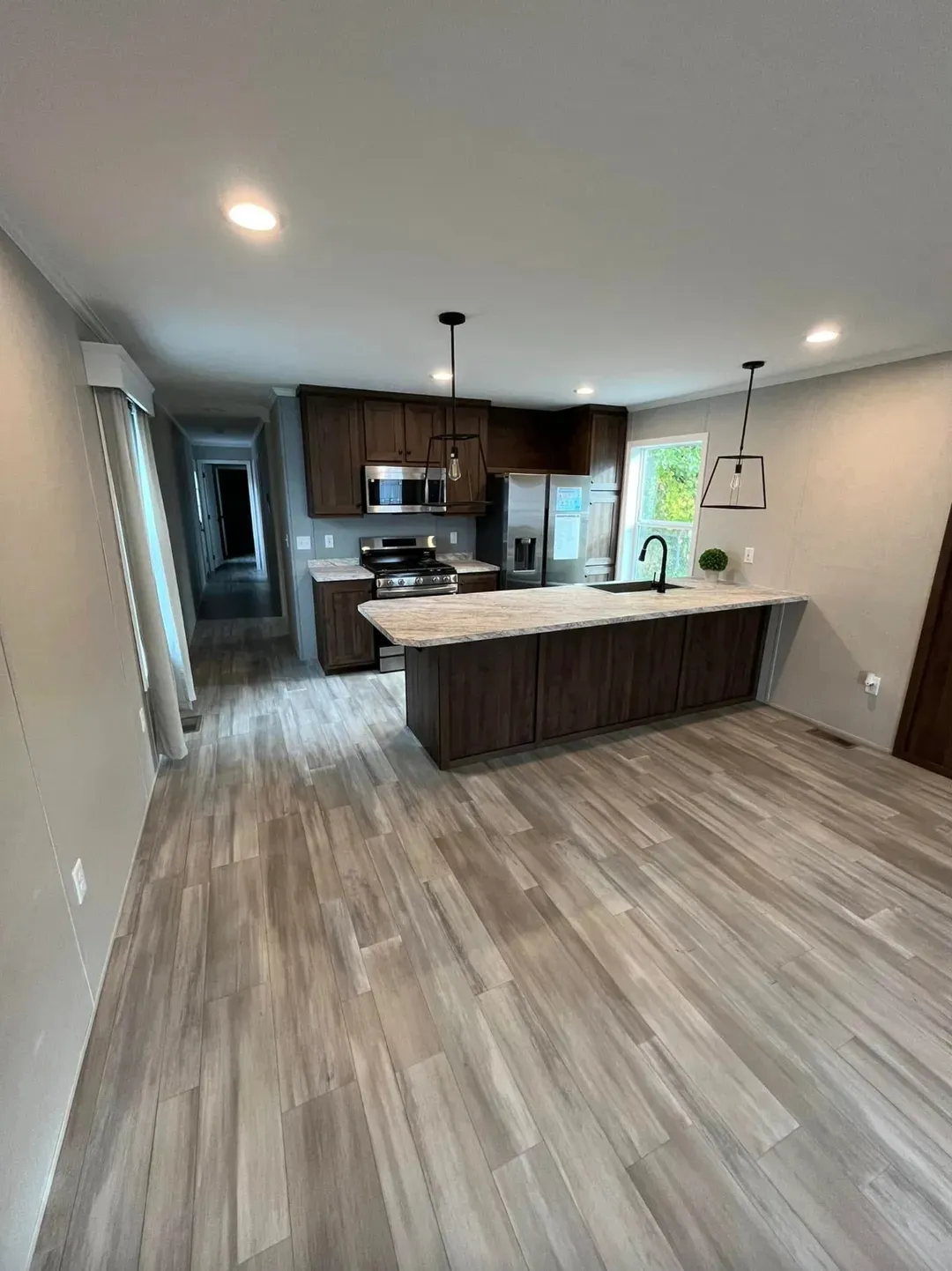 The PERIDOT 60 Living Room. This Manufactured Mobile Home features 2 bedrooms and 2 baths.