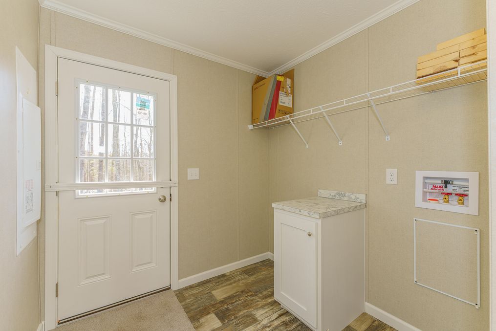 The SWEET BREEZE 72 Utility Room. This Manufactured Mobile Home features 4 bedrooms and 2 baths.