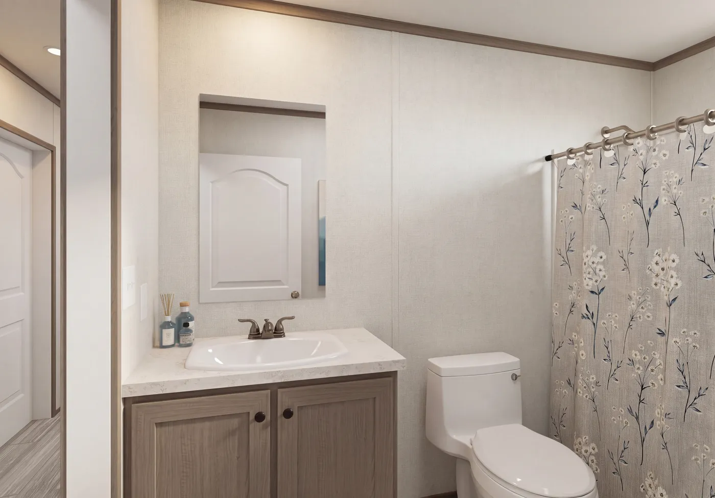 The THE MOUNTAINEER 64 Guest Bathroom. This Manufactured Mobile Home features 3 bedrooms and 2 baths.