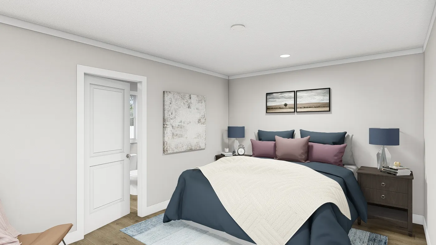 The MOVE ON UP Primary Bedroom. This Manufactured Mobile Home features 3 bedrooms and 2 baths.