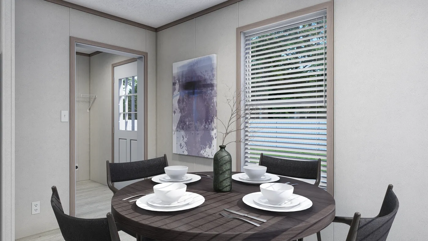The 4824-E734 THE PULSE Dining Room. This Manufactured Mobile Home features 3 bedrooms and 2 baths.