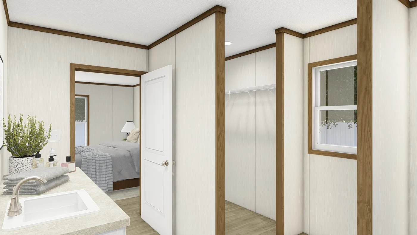 The THE EMPOWER Primary Bathroom. This Manufactured Mobile Home features 4 bedrooms and 2 baths.