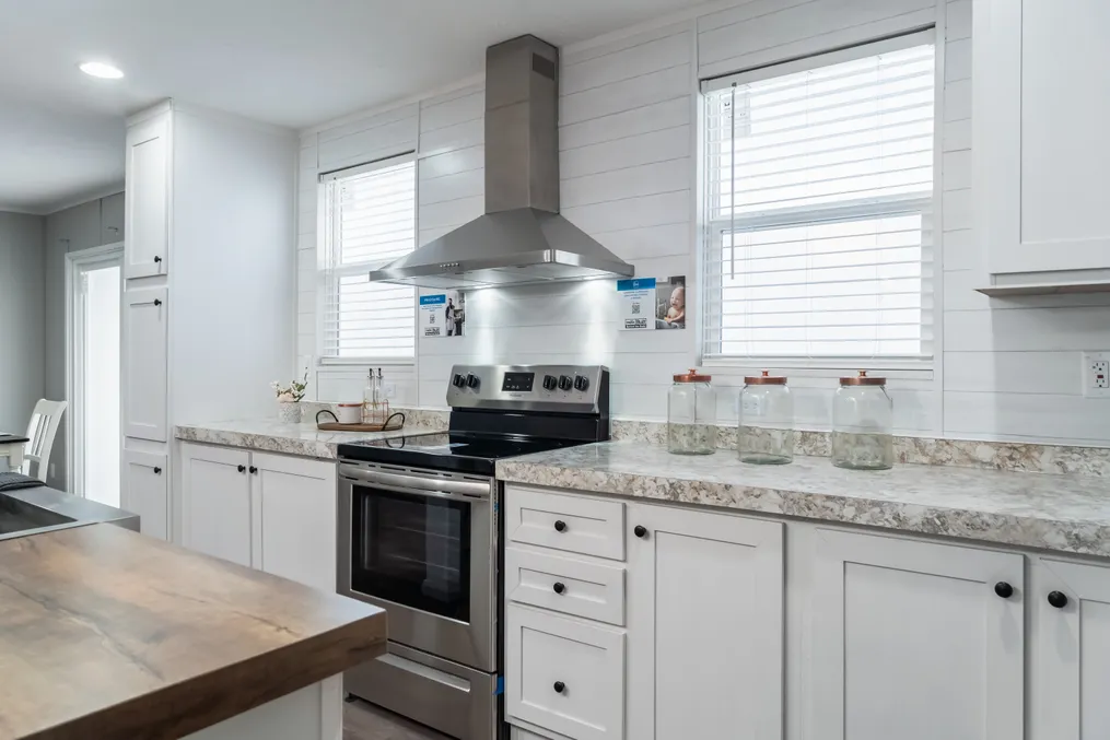 The TRADITION 72 Kitchen. This Manufactured Mobile Home features 4 bedrooms and 2 baths.