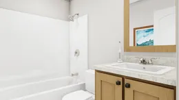 The STAND BY ME Guest Bathroom. This Manufactured Mobile Home features 3 bedrooms and 2 baths.