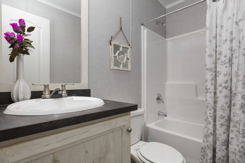 The SAPPHIRE Guest Bathroom. This Manufactured Mobile Home features 3 bedrooms and 2 baths.