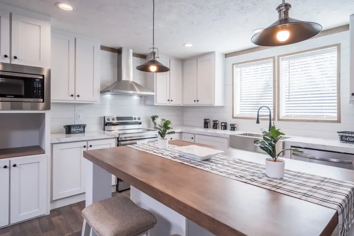 The FARMHOUSE BREEZE 72 Kitchen. This Manufactured Mobile Home features 4 bedrooms and 2 baths.
