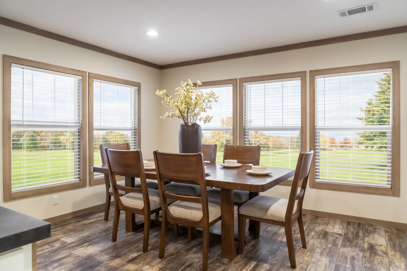 The BOUJEE PREMIER Dining Room. This Manufactured Mobile Home features 4 bedrooms and 2 baths.