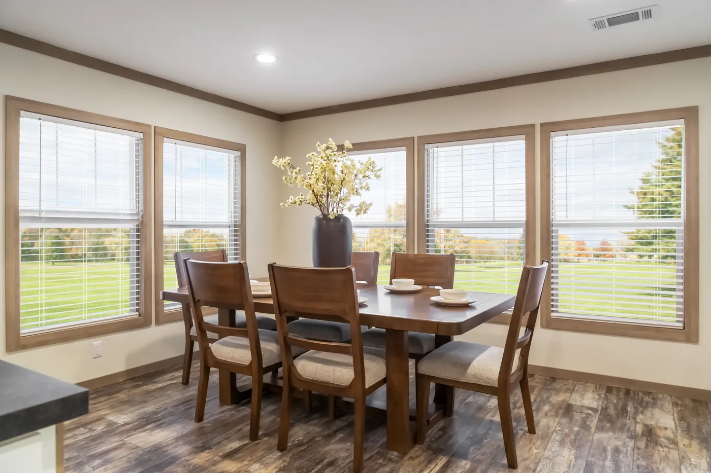 The BOUJEE PREMIER Dining Room. This Manufactured Mobile Home features 4 bedrooms and 2 baths.