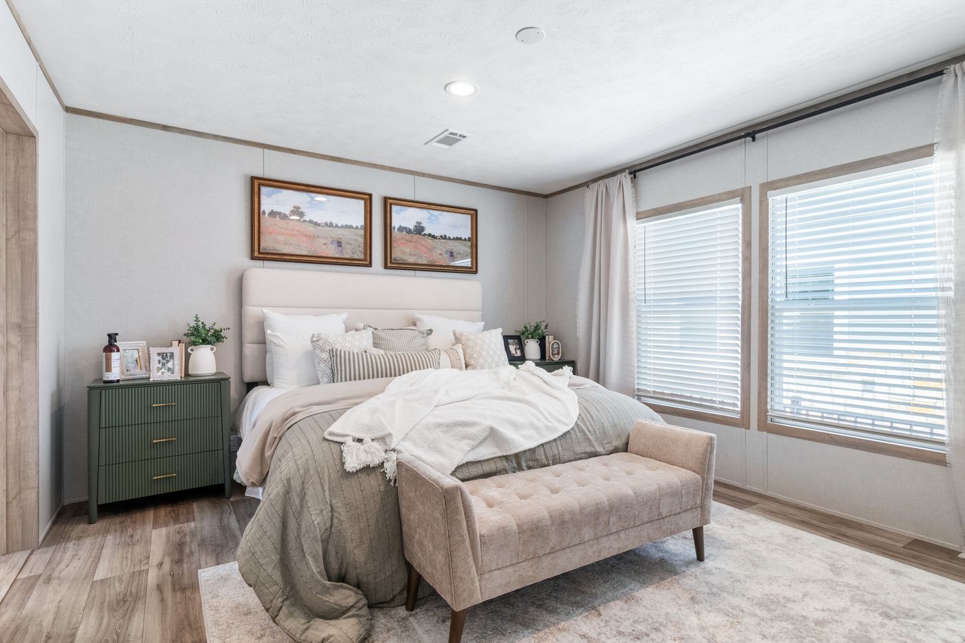 The THE REAL DEAL Primary Bedroom. This Manufactured Mobile Home features 3 bedrooms and 2 baths.