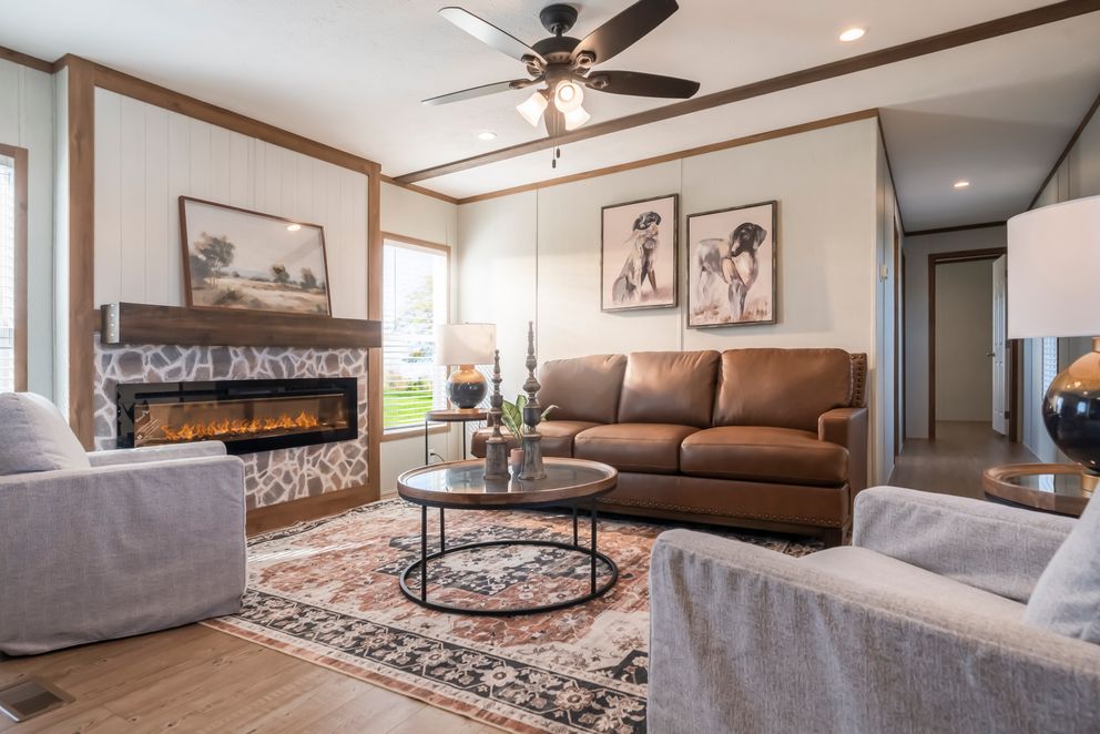 The SEAS THE DAY Living Room. This Manufactured Mobile Home features 3 bedrooms and 2 baths.