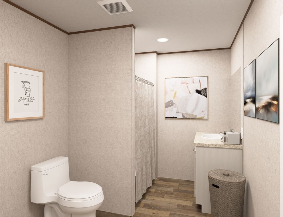 The OAK Primary Bathroom. This Manufactured Mobile Home features 4 bedrooms and 2 baths.